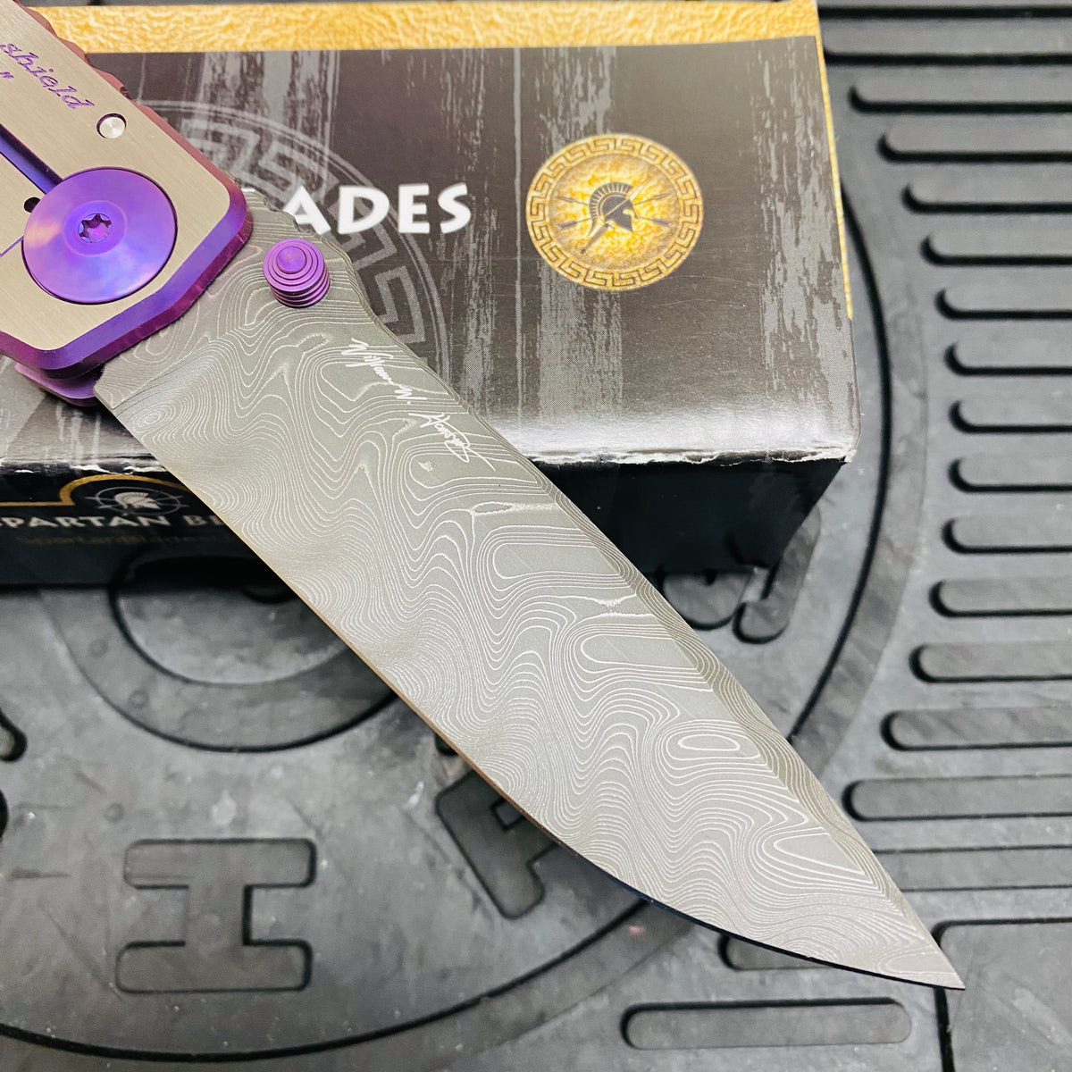Spartan Blades Harsey Folder - PURPLE Shield with Purple Stone, Chad Nichols Damascus Blade, Purple ANO Hardware Knife